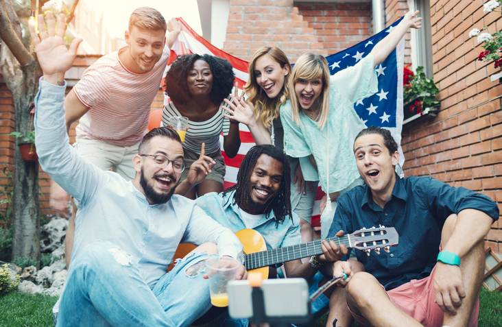 Happy Young People Making Selfie In A Backyard.